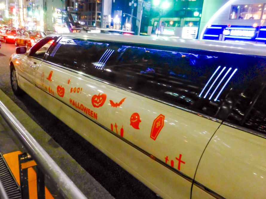 Limo with Halloween decorations on the side.